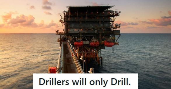 Oil drill sitting in the middle of the ocean
