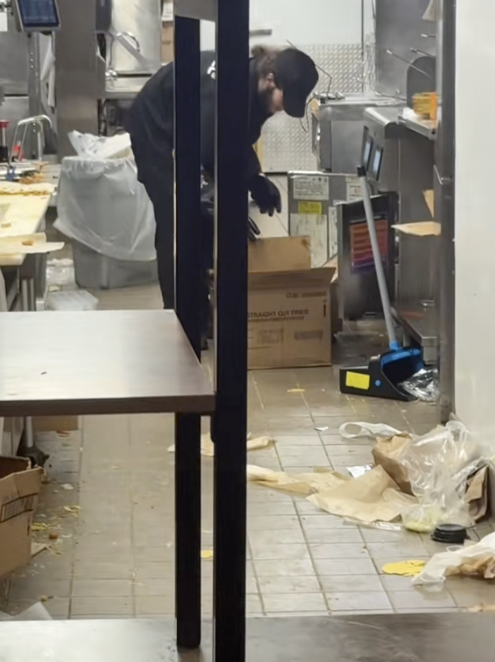 man in a taco bell kitchen