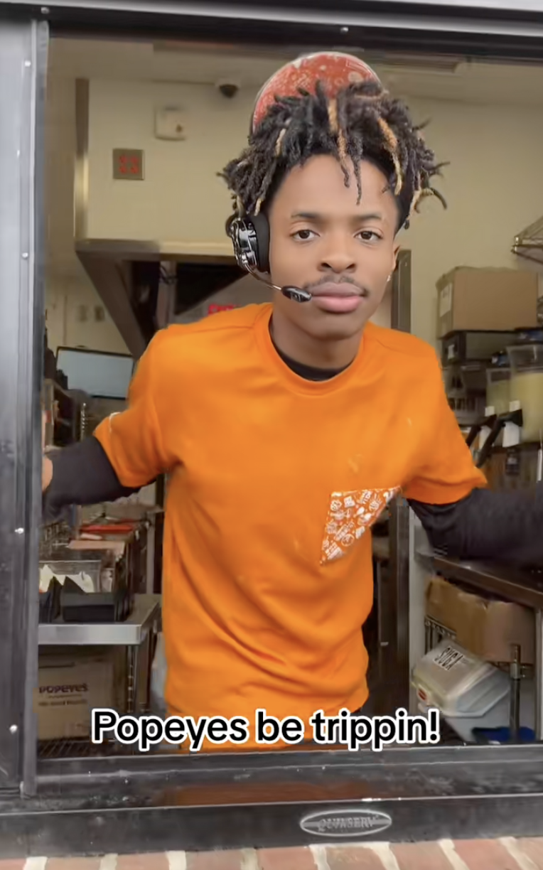 man in a drive-thru window