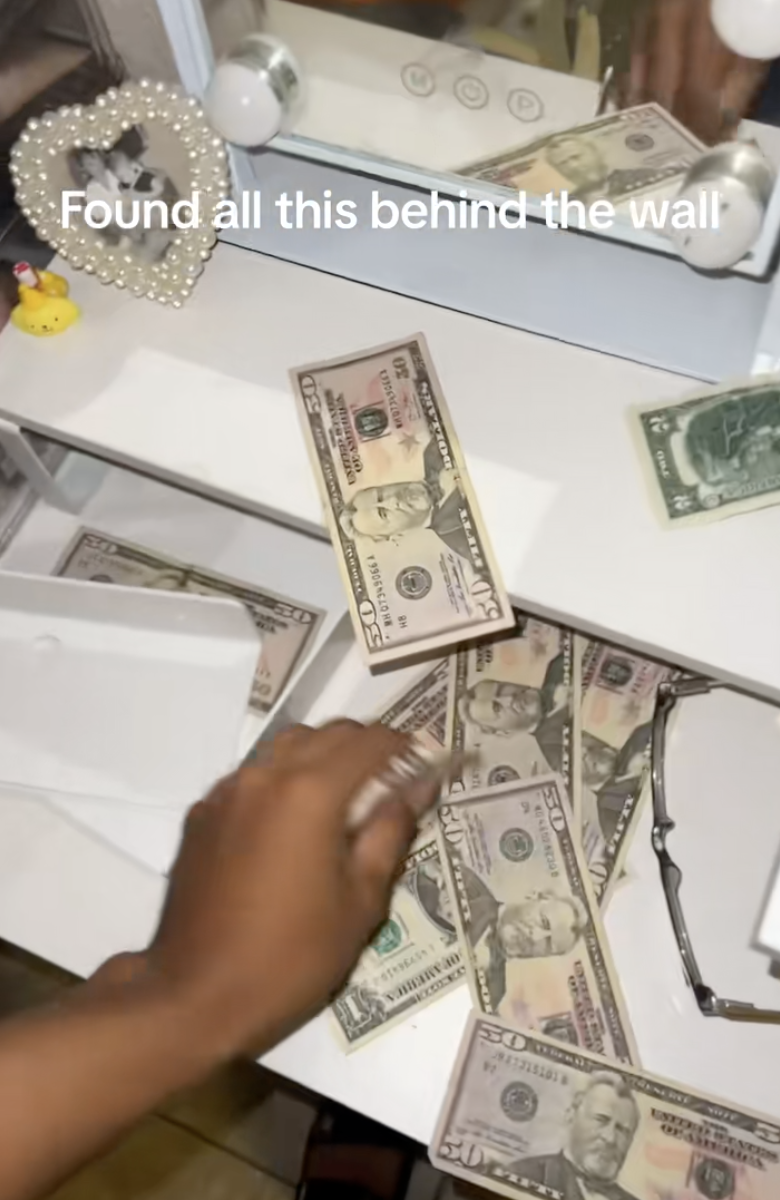 piles of money on a dresser