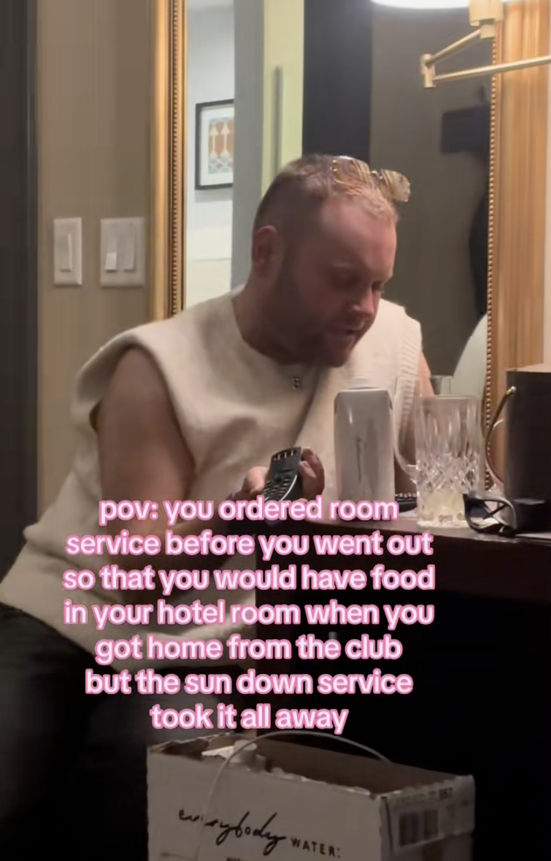 man sitting in a hotel room