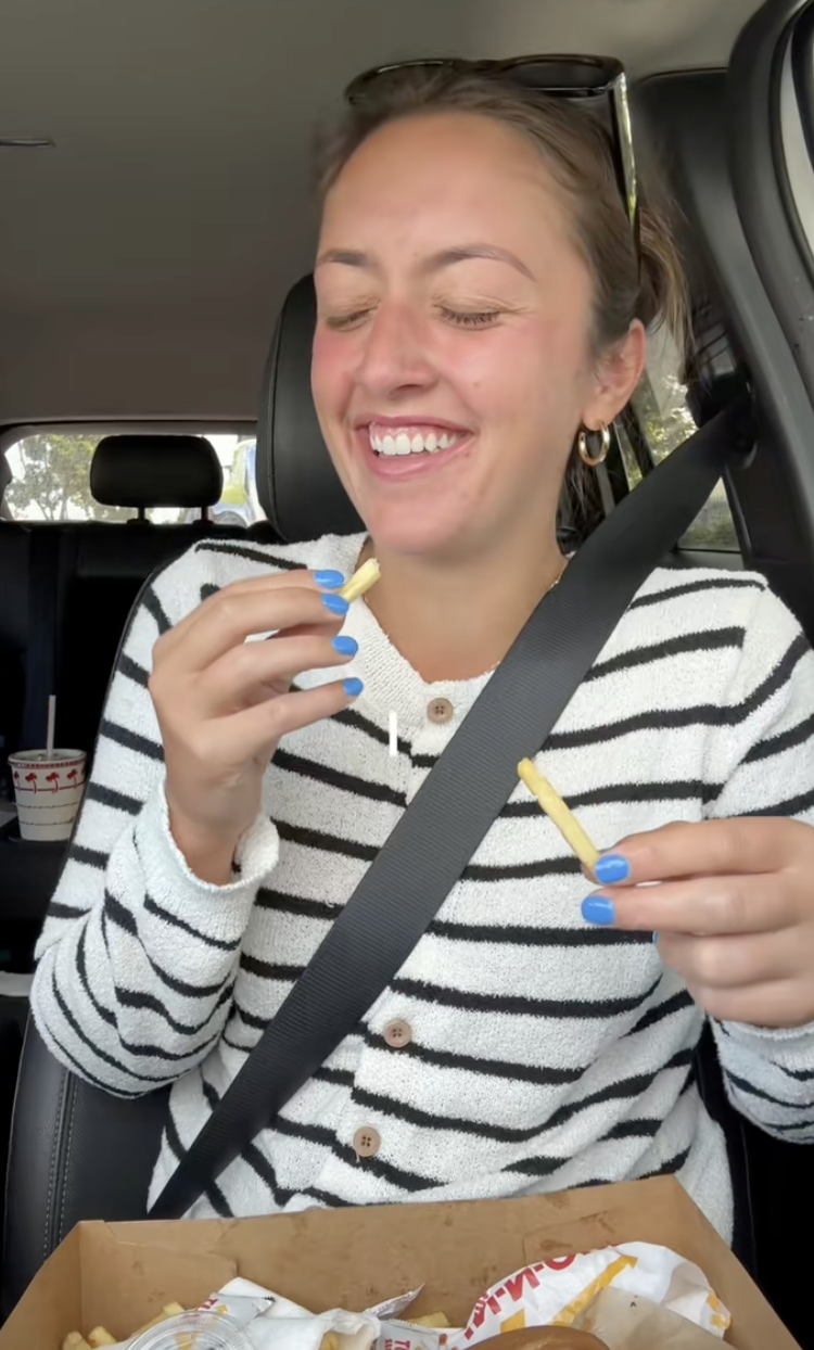 woman laughing in her car