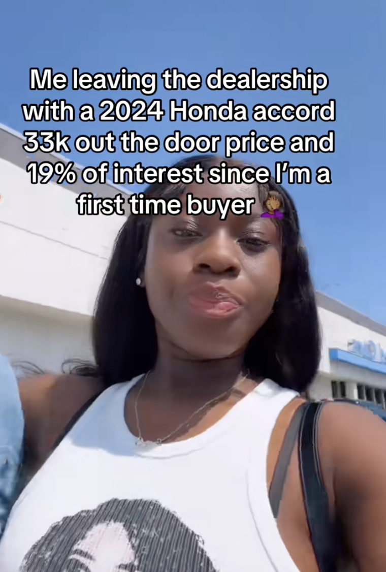 woman outside a car dealership