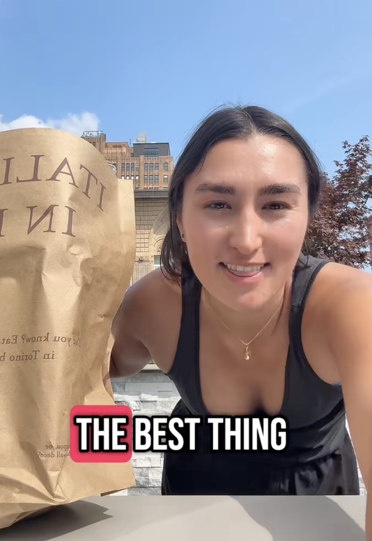 woman with a bag of groceries