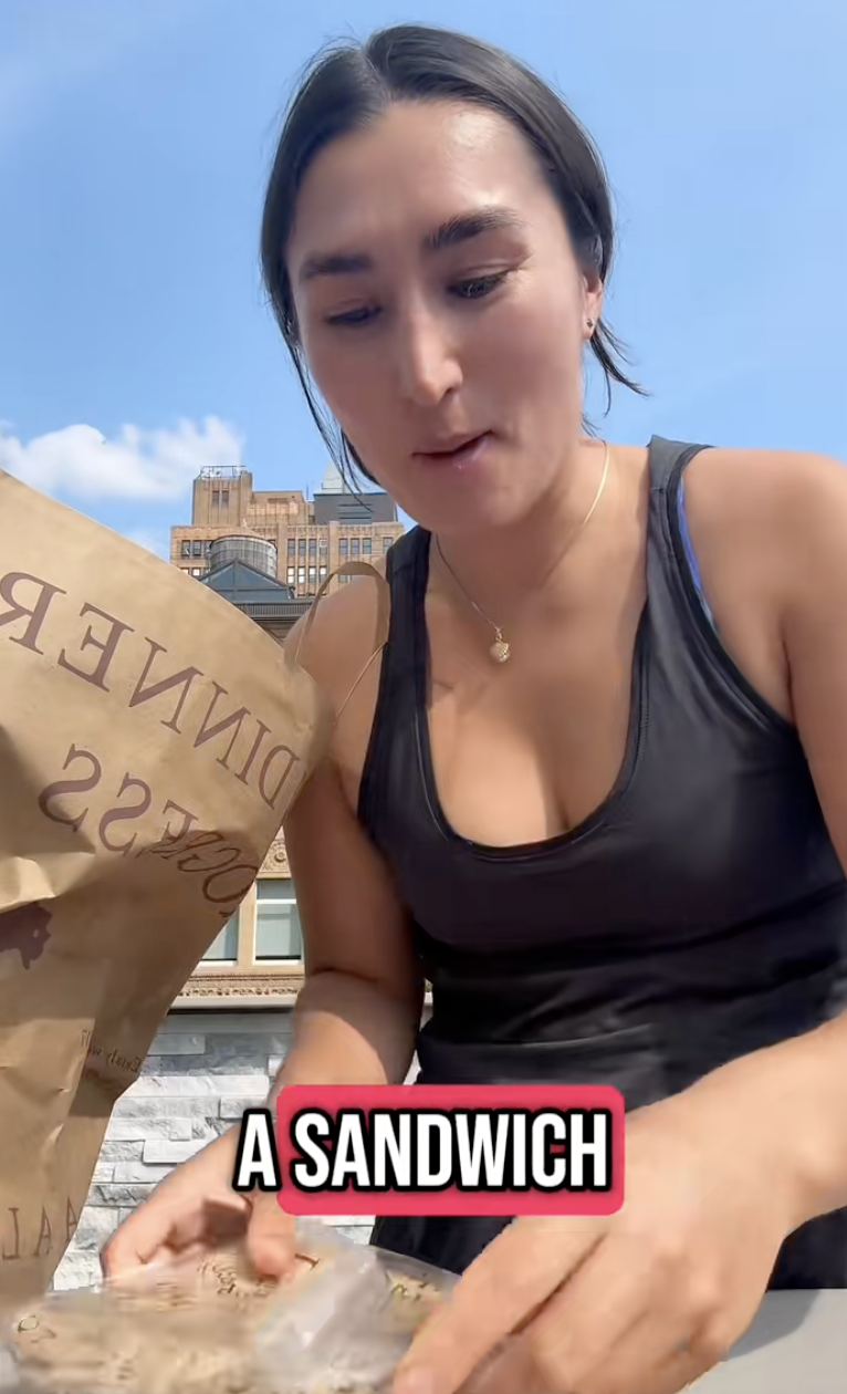 woman with a bag of food