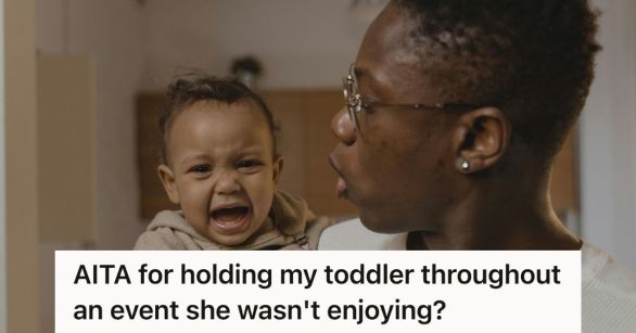 Man holding a crying baby girl