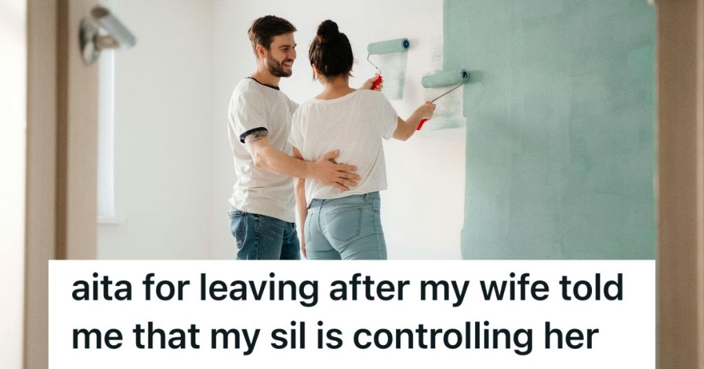 Man and woman painting a wall together