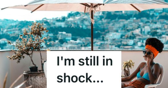 Woman outside under a table shade