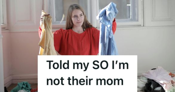 Woman holding up men's laundry