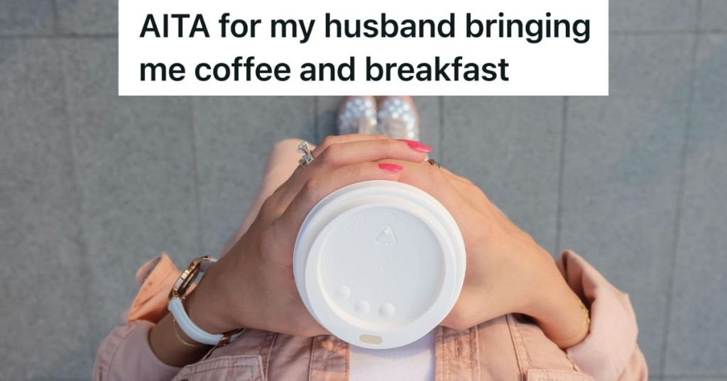 Woman holding disposable coffee cup