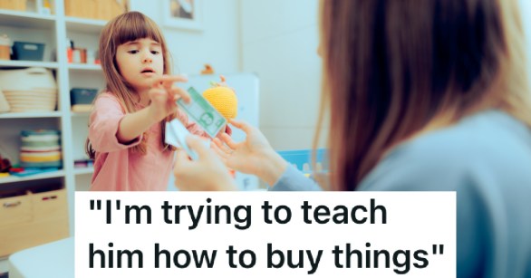 little girl paying for goods