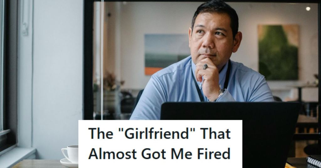Man sitting at his computer thinking about the girlfriend who almost got him fired