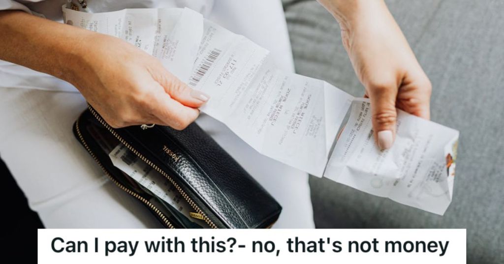 Woman holding a receipt from her wallet