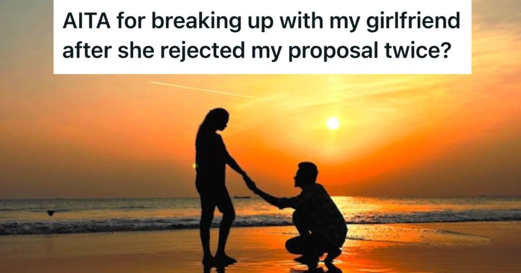 Silhouette of a man proposing to a woman at the beach at sunset