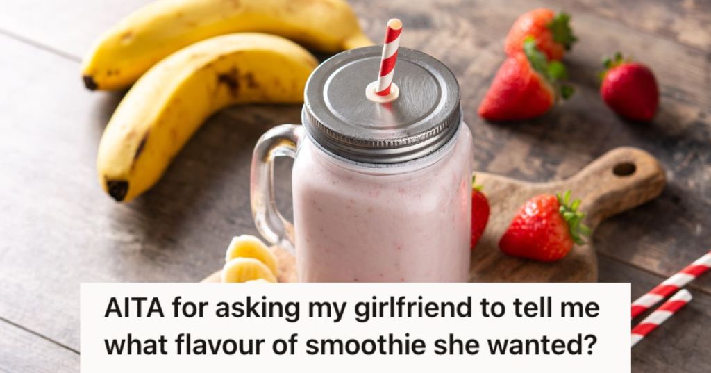 Strawberry banana smoothie in a jar with straw