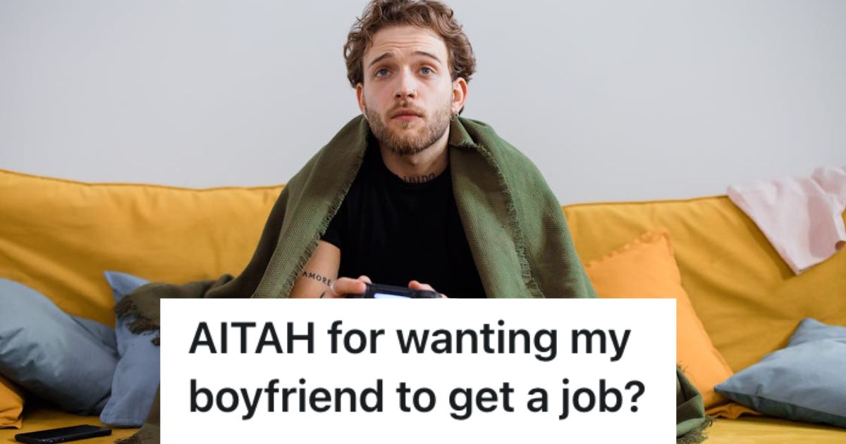 Man playing video game while sitting on the couch