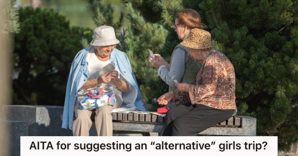 Senior women playing cards in the park