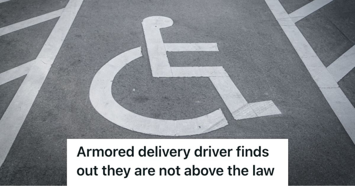 A handicap parking space with a sign on the ground