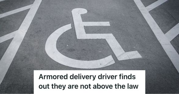 A handicap parking space with a sign on the ground