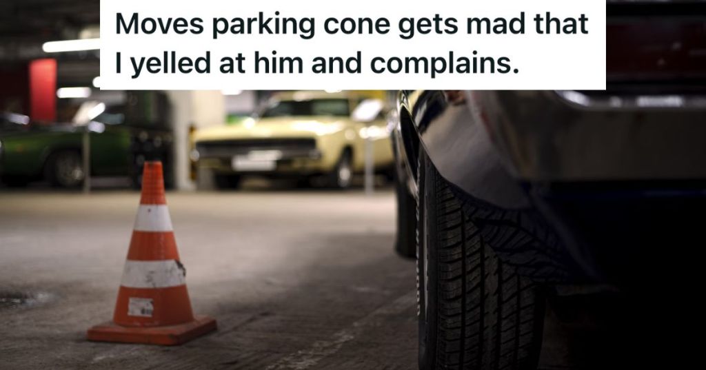 Car parked next to a cone