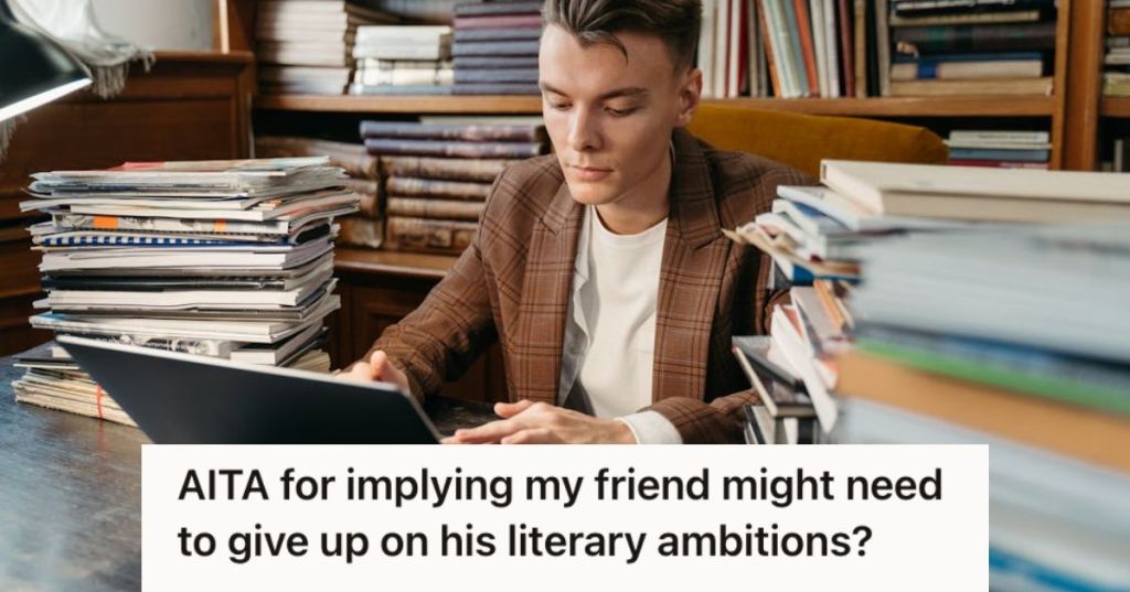 Man focused while working on his laptop on a desk filled with books and reports