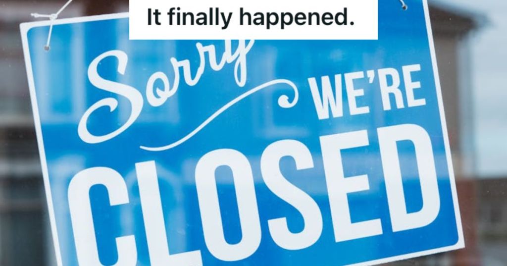 A closed sign on the front door of a store