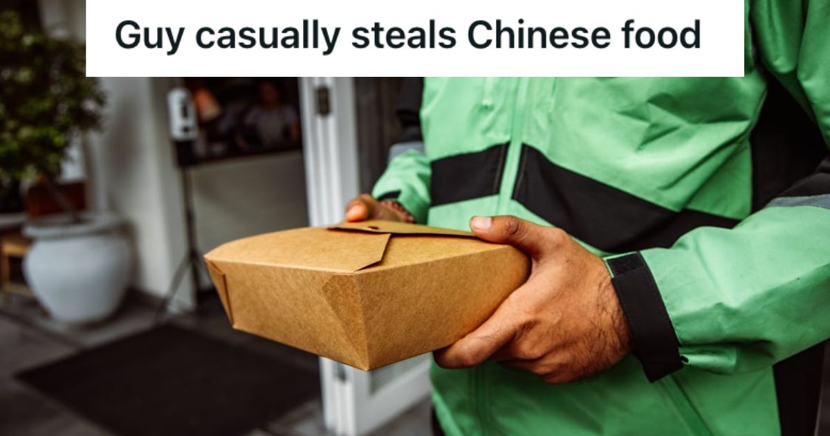 Man in jacket holding a box of takeout food