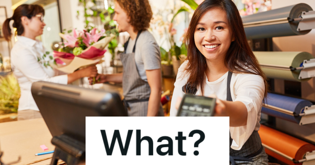 smiling cashier working in the gardening section of a store