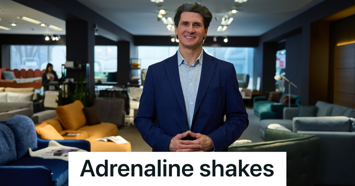 older man in a suit in a furniture store