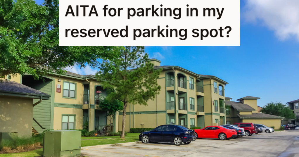 cars parking next to an apartment building