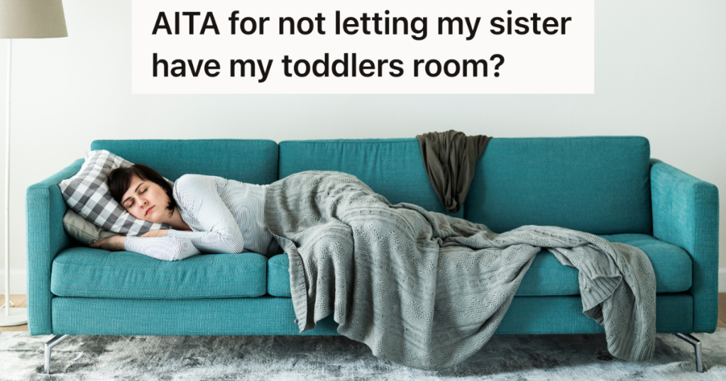 woman sleeping on a blue couch