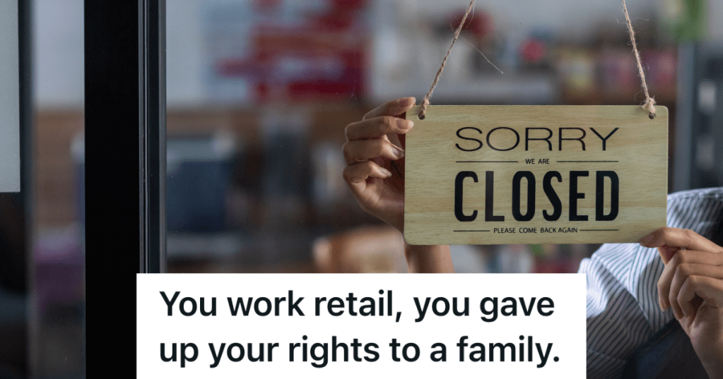 employee putting sign in window that reads "sorry closed"