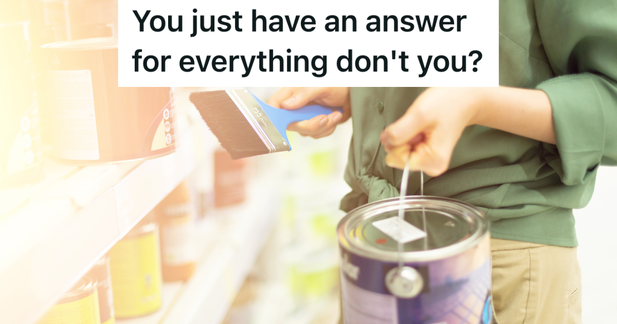 woman holding paint and paintbrush