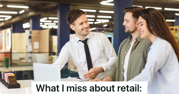 salesman helping couple with purchase