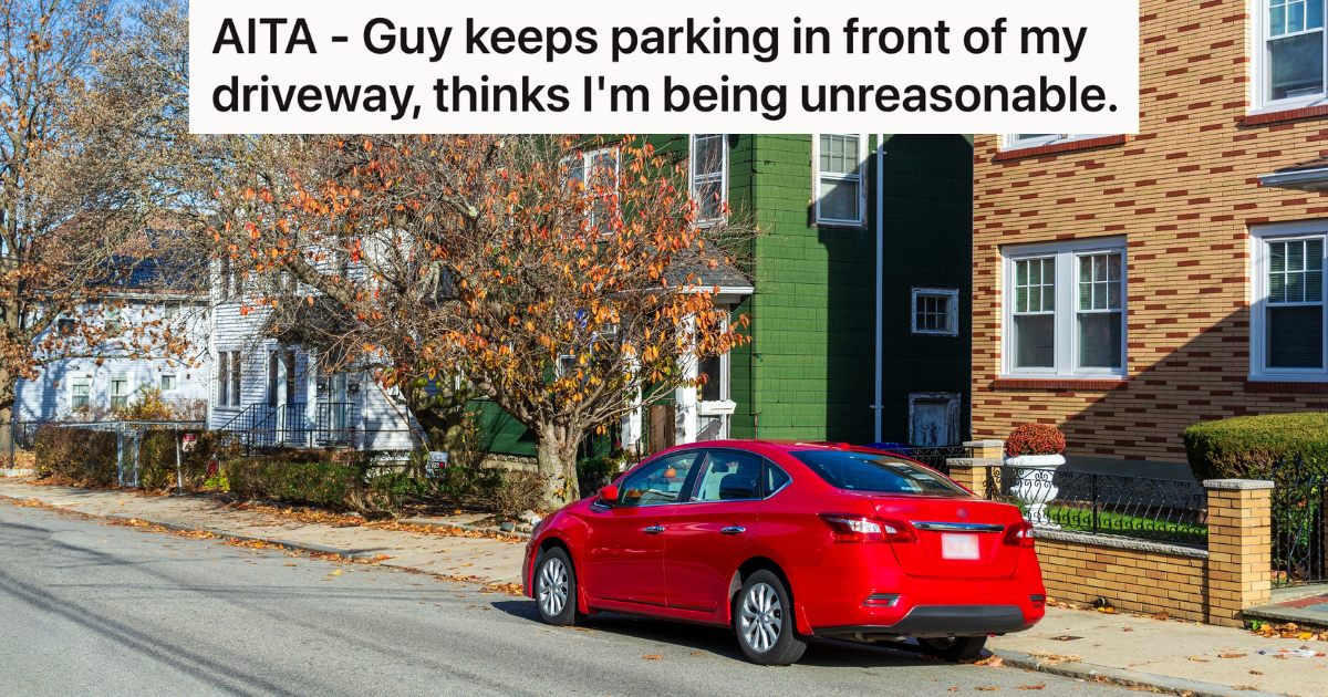red car parked on street in front of house