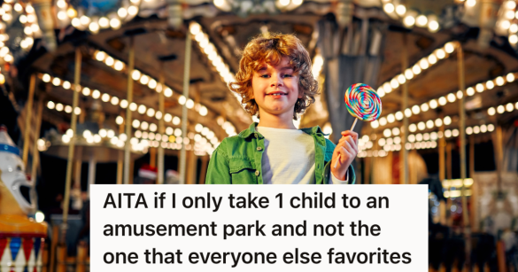 boy stands in front of carousel holding lollipop
