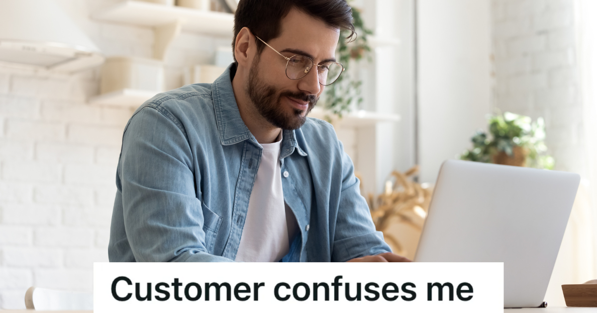 man looking at laptop computer