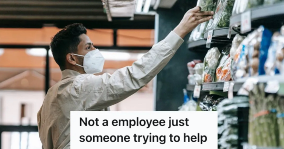 man reaching for something on a store shelf