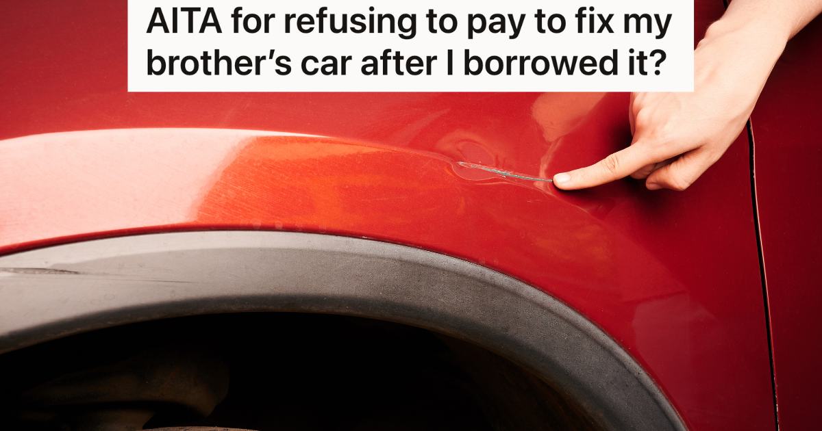 hand pointing at dent on red car