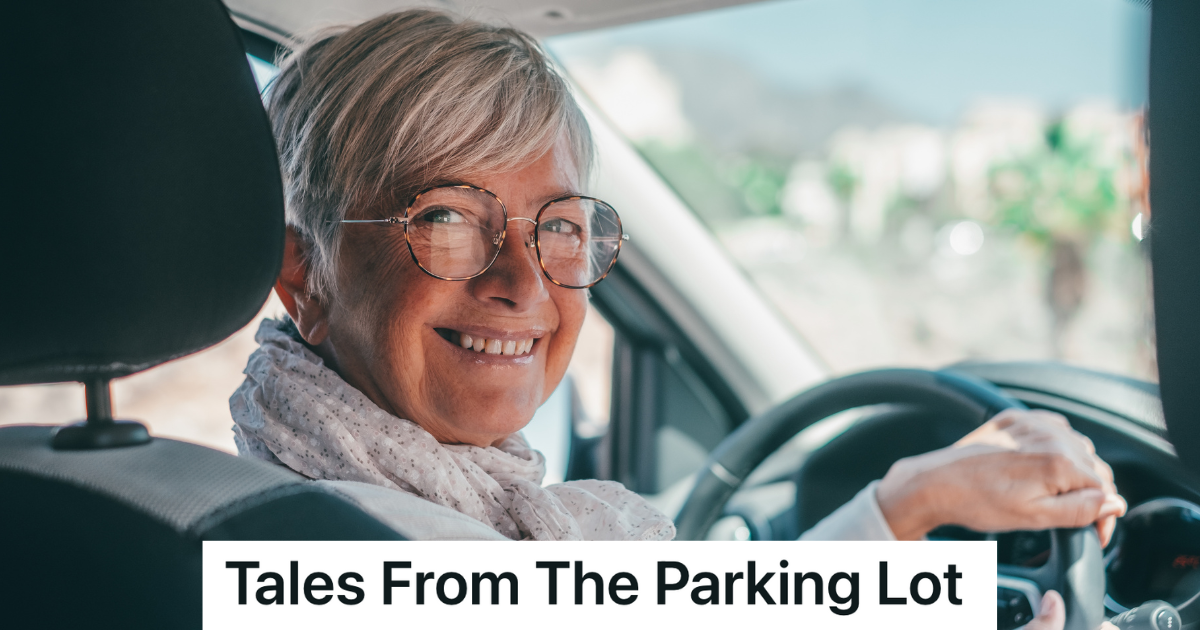 smiling older lady with grey hair in the drivers seat of her car