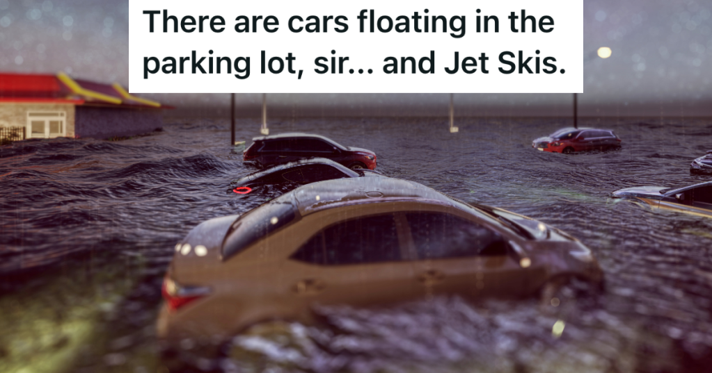 cars floating in water in flooded parking lot