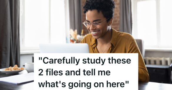 woman smiling while typing on computer