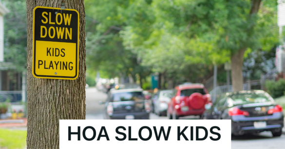 sign on tree that reads "slow down kids playing"