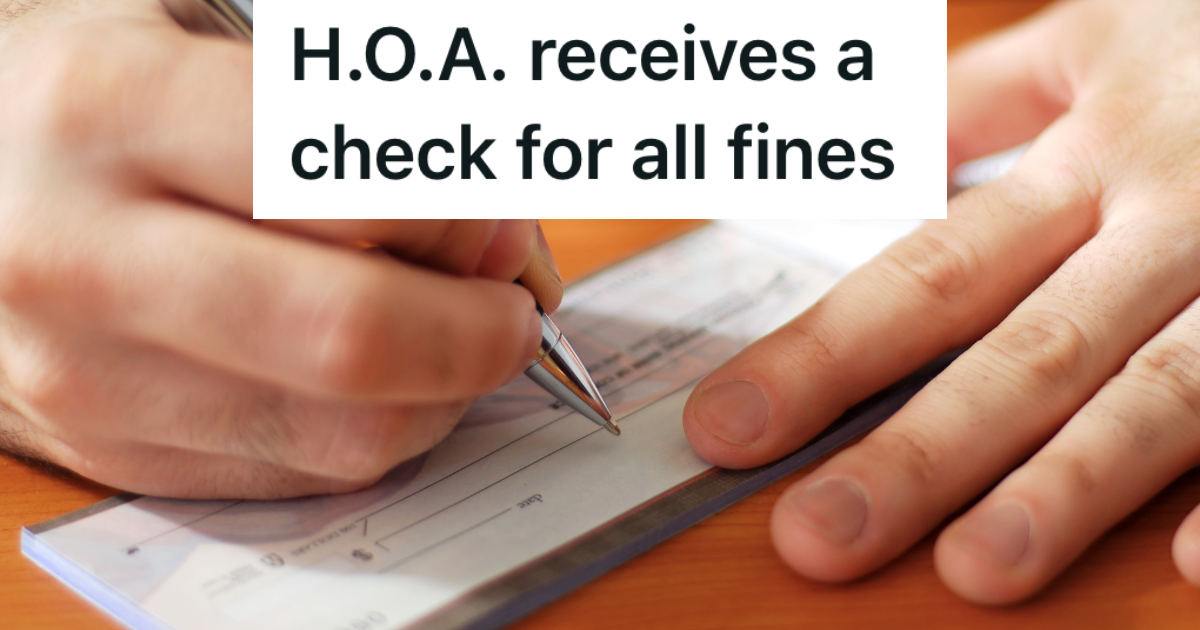 closeup of man writing a personal check