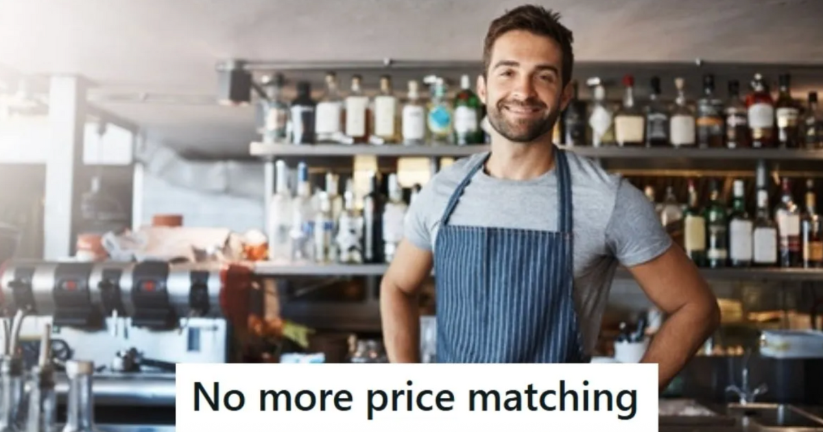 smiling man working in liquor store
