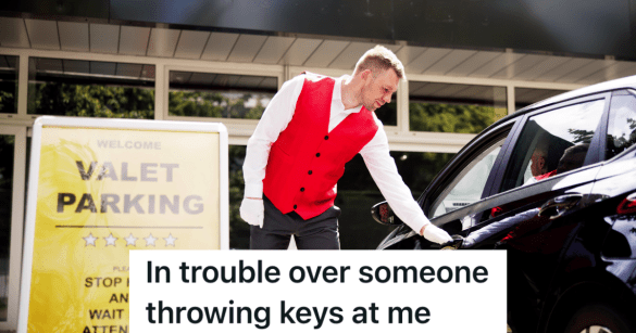 man in red vest standing next to sign that reads "valet parking"