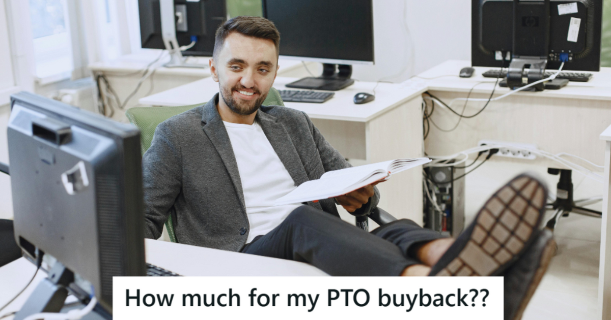 Man in suit sitting with he feet up on the desk