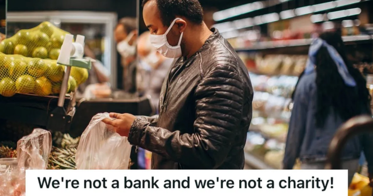 Man holding a plastic bag inside the grocery store