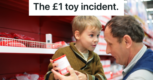 grandfather and grandson looking at something in a store