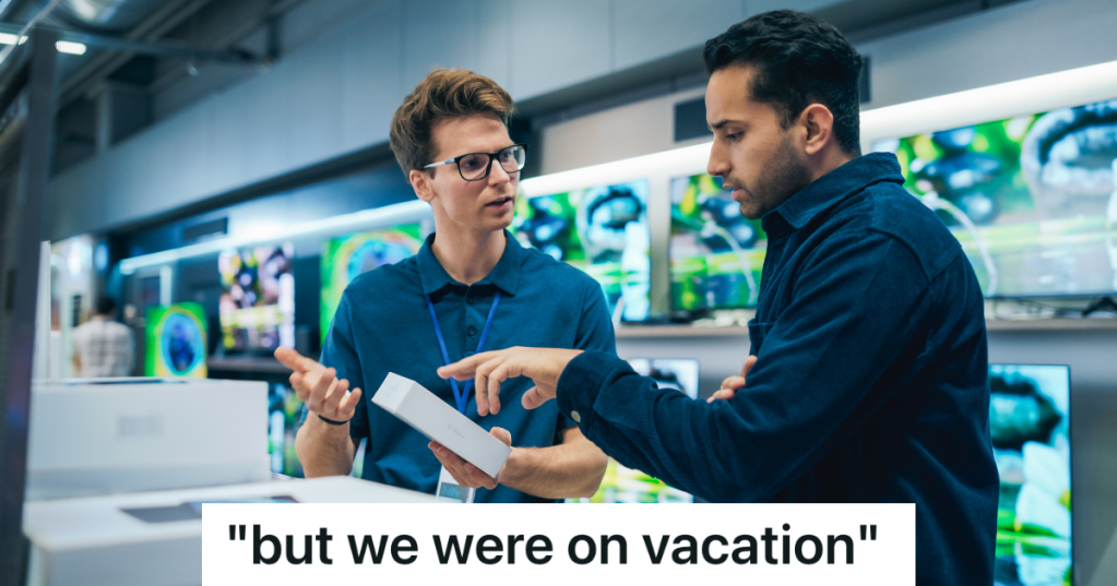 employee helping customer look at electronics